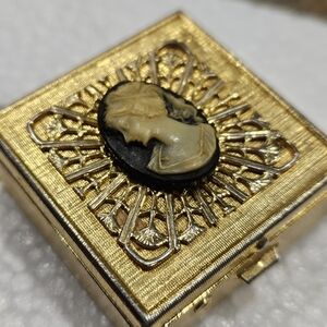 Elegant Gold and Black Cameo Brooch